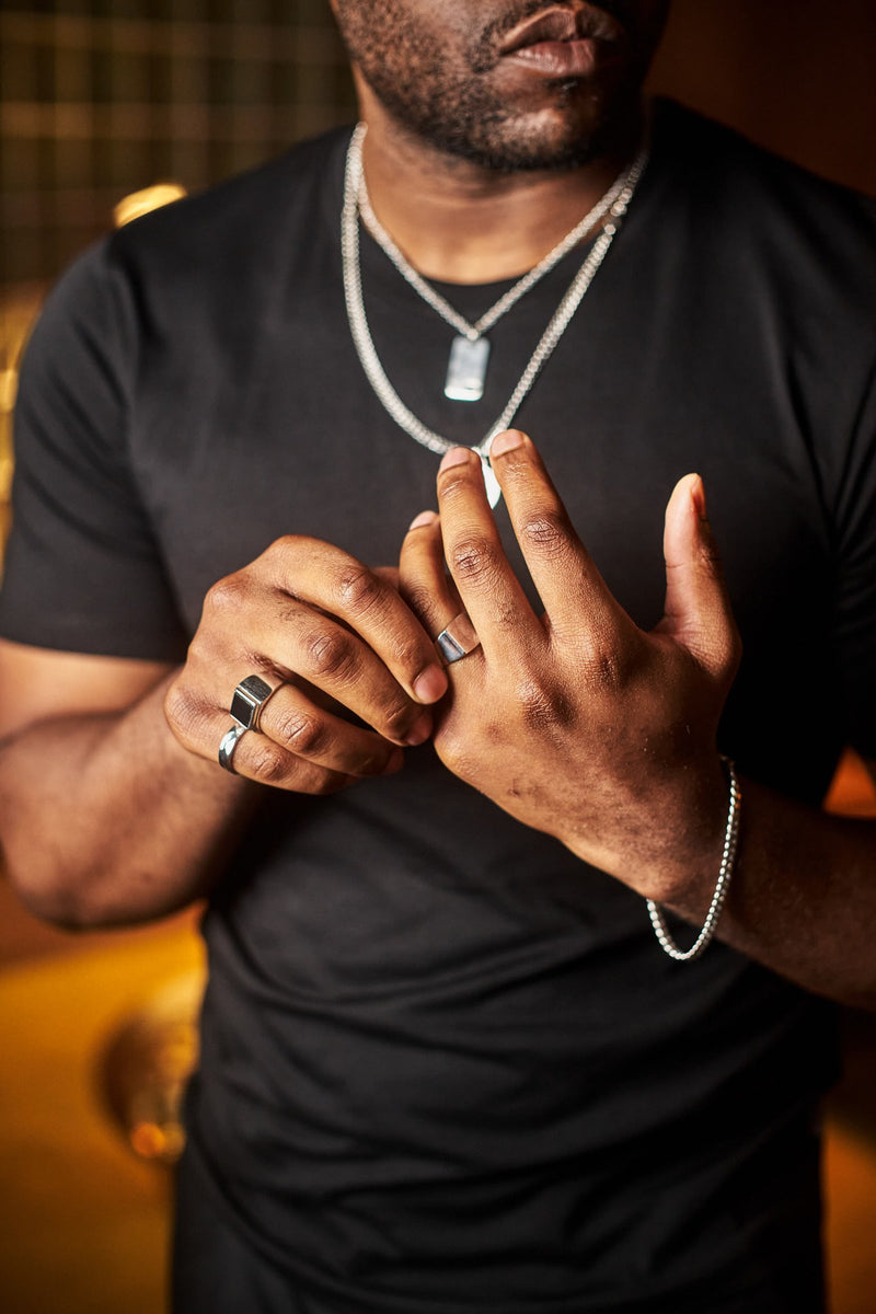Cuban Bracelet 5mm - Man wearing rings, necklaces, dog tag, and bracelet.