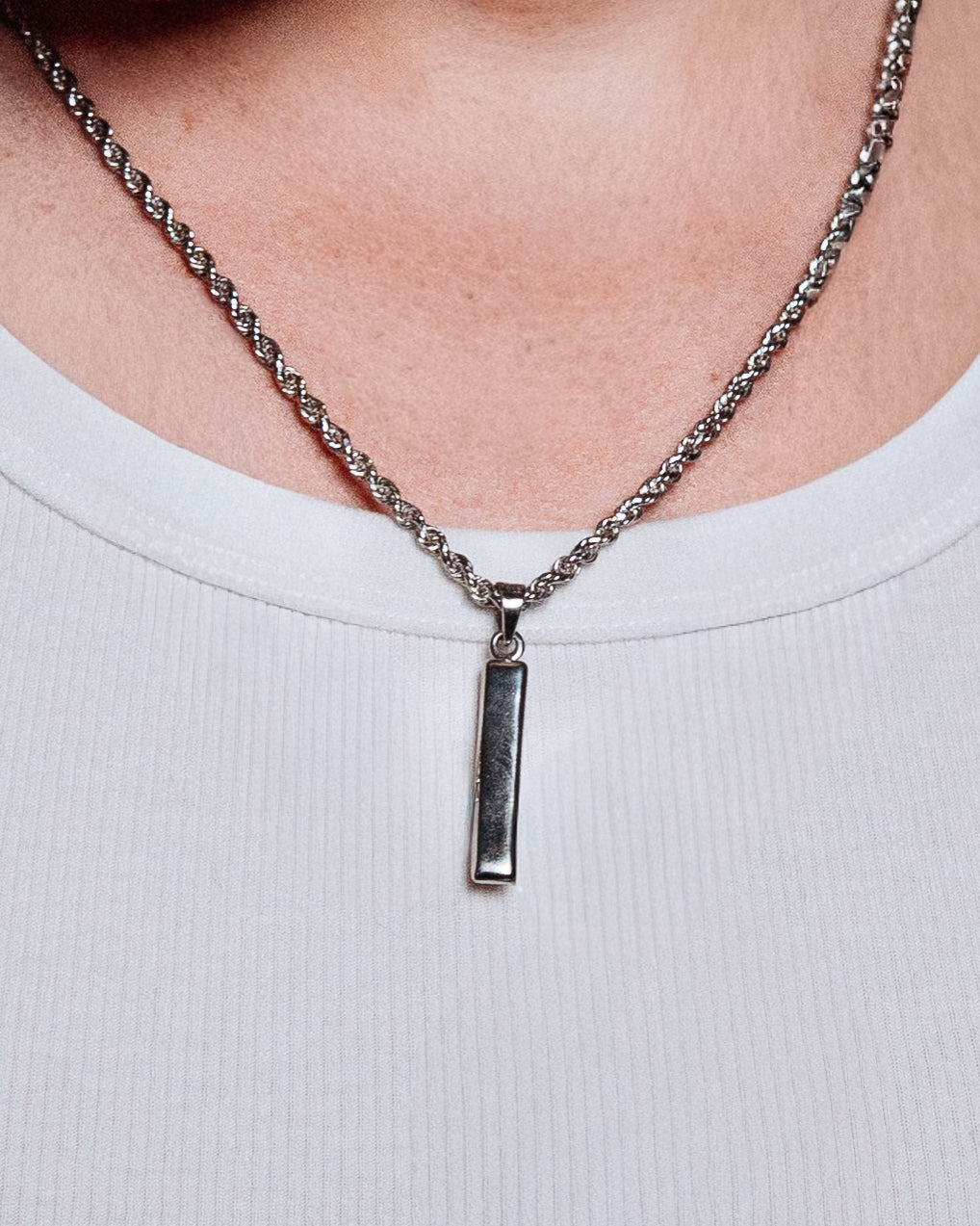 Totem Pendant - styled with Crown Dog Tag, St Christopher Pendant, Cuban Chain 5mm and Rope Chain 3mm, pendants and chains styled together on dark wood surface