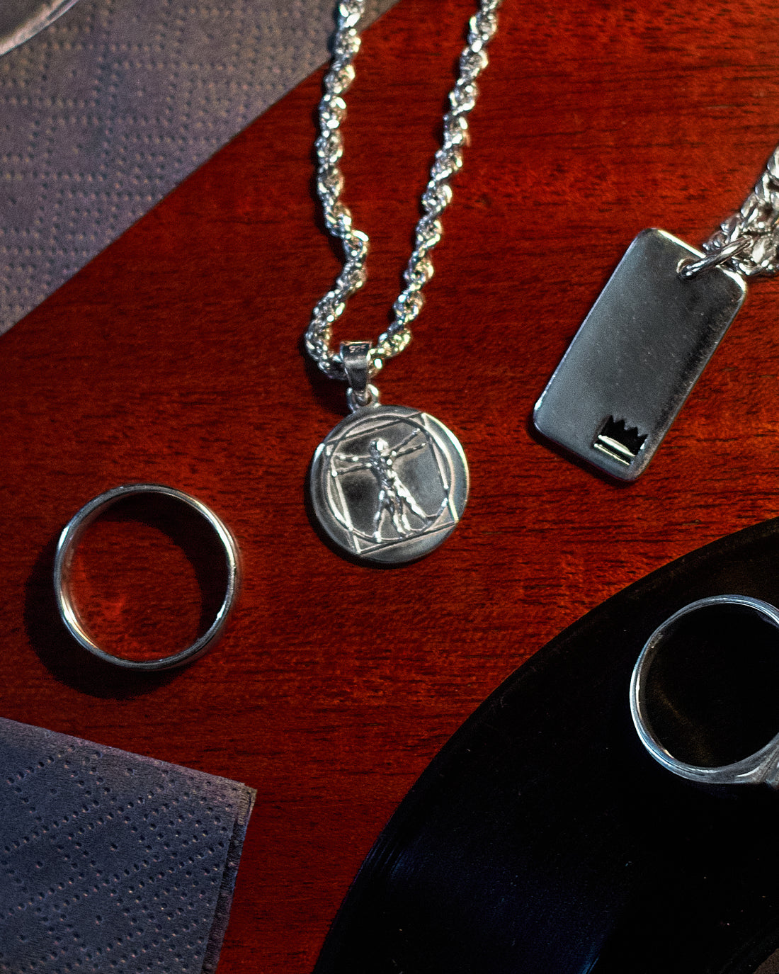 Vitruvian Pendant - styled with Crown Dog Tag, Plain Signet Ring and Rope Chain 3mm, tabletop arrangement