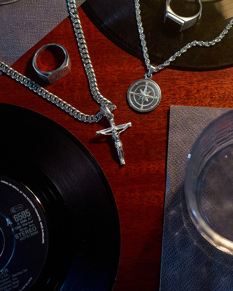 Crucifix Pendant - styled with Plain Signet Ring, Compass Pendant, Cuban Chain 5mm, Rope Chain 3mm and Onyx Signet Ring, layered jewellery on hand and chain