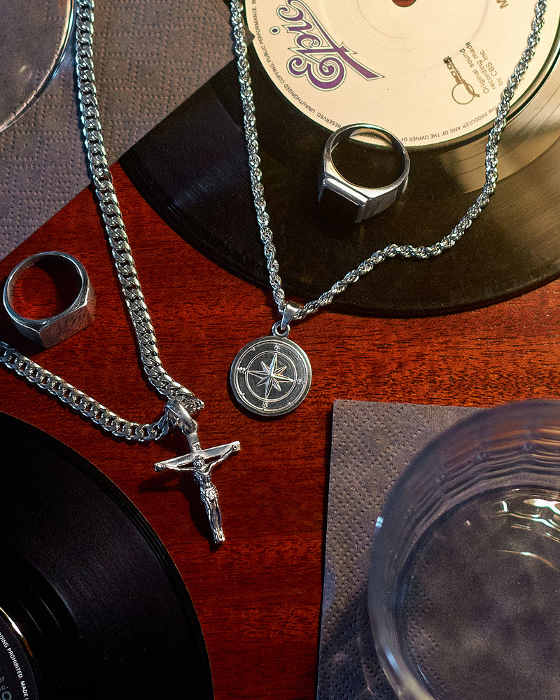 Compass Pendant - styled with Plain Signet Ring, Crucifix Pendant, Cuban Chain 5mm, Rope Chain 3mm and Onyx Signet Ring, layered jewellery on hand and chain