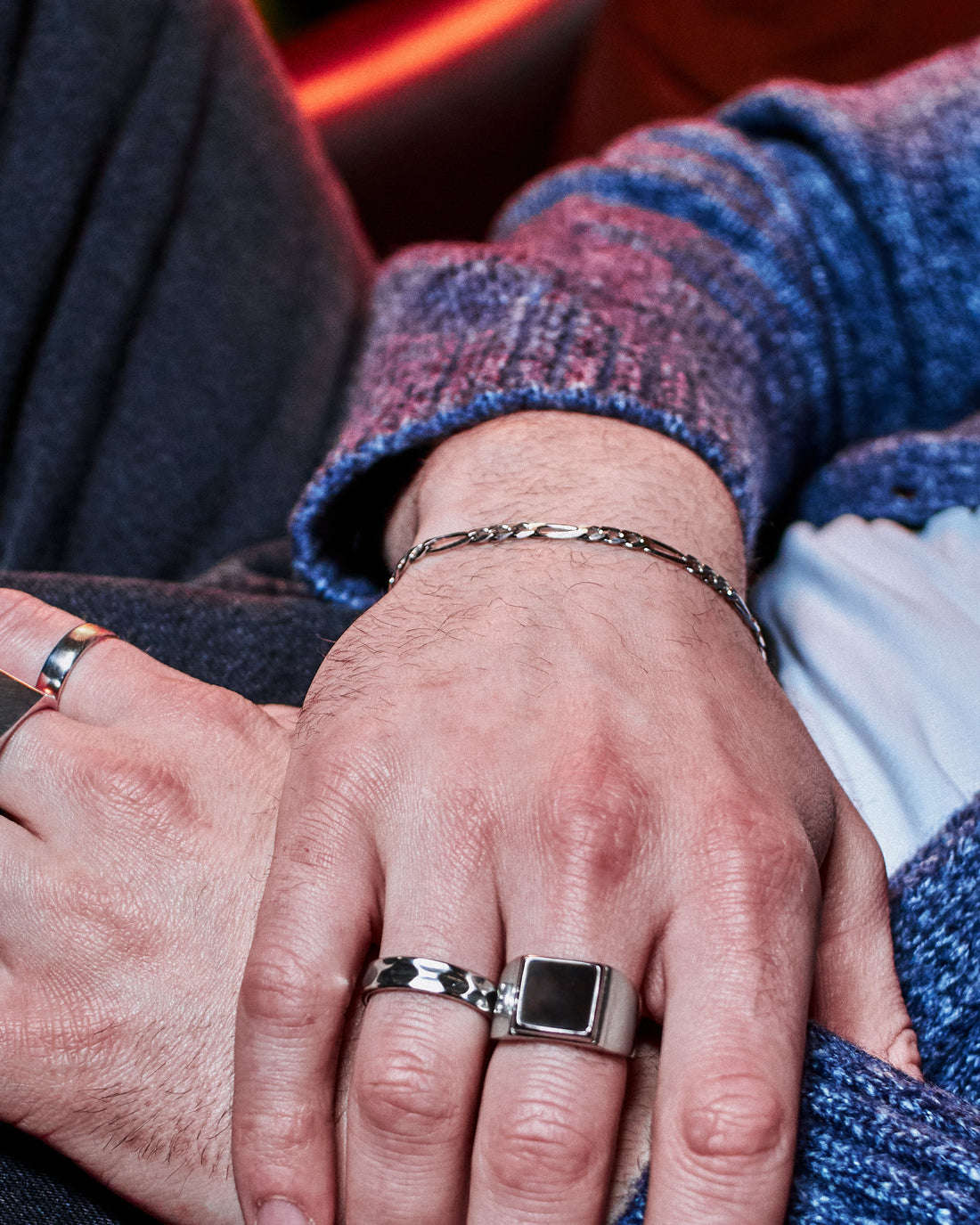 Figaro Bracelet 5mm - styled with Crown Signet Ring and Plain Band Ring, hand resting on dark denim jacket