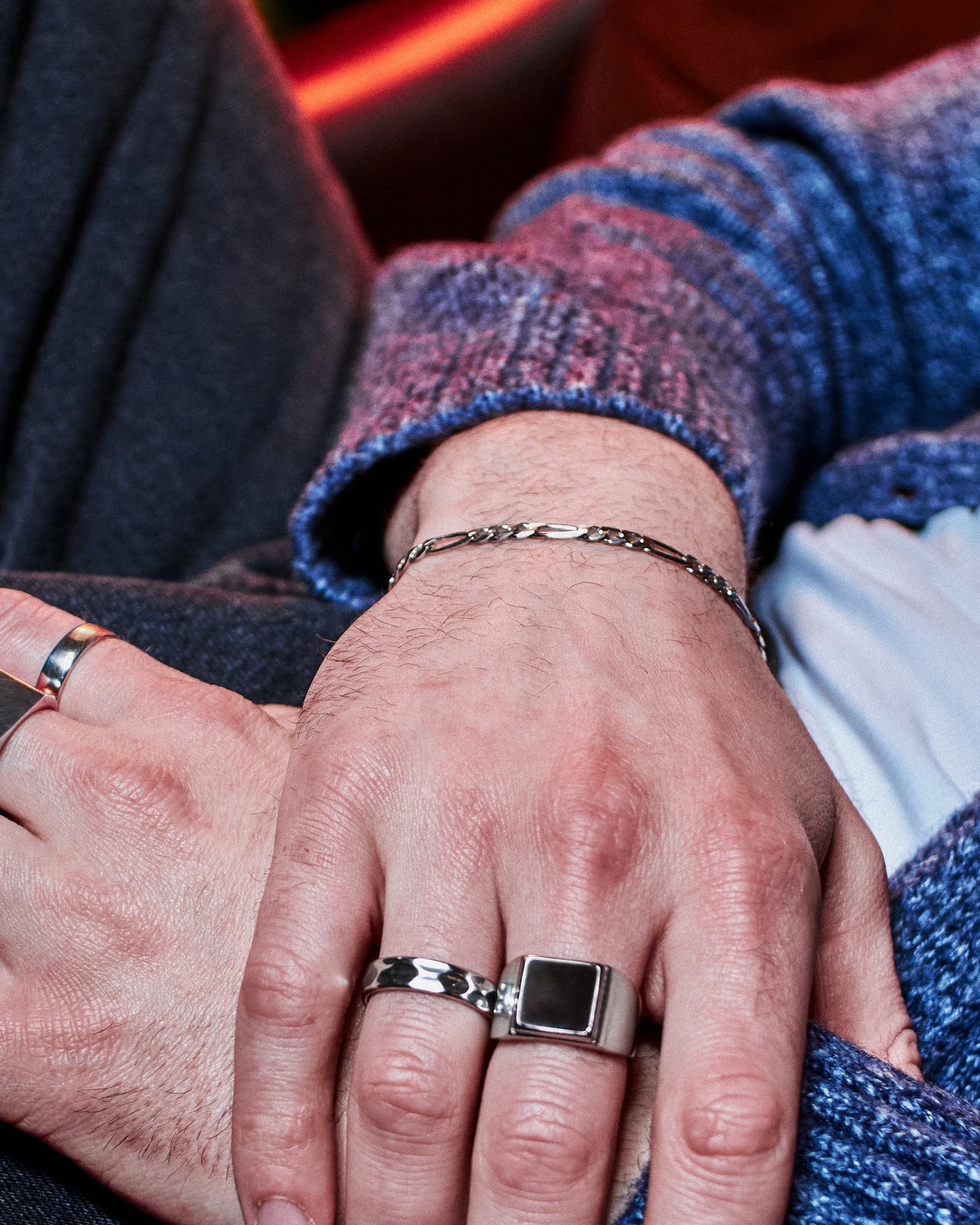 Figaro Bracelet 5mm - styled with Crown Signet Ring and Plain Band Ring, hand resting on dark denim jacket