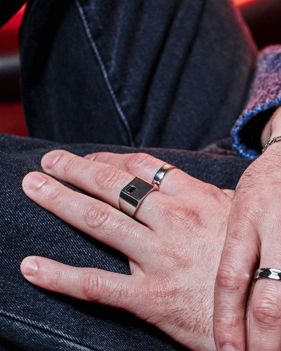 Plain Band Ring - styled with Crown Signet Ring, hand resting on dark denim jacket