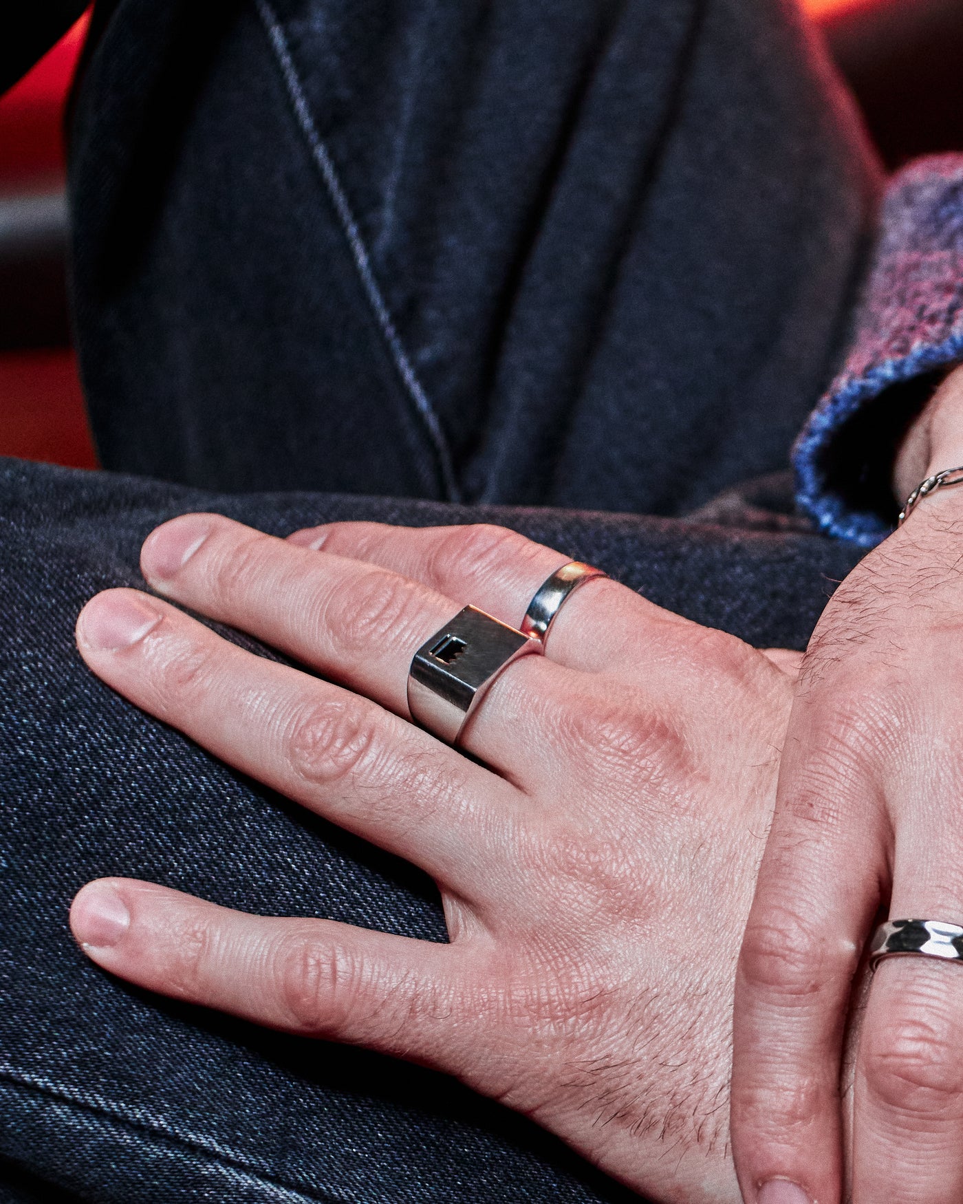 Plain Band Ring - styled with Crown Signet Ring, hand resting on dark denim jacket