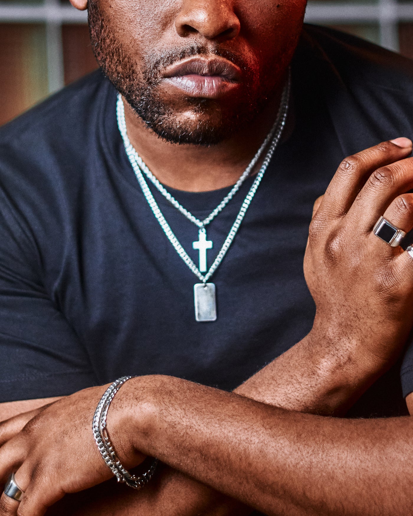 Latin Cross Pendant - styled with Onyx Signet Ring, Plain Signet Ring, Hammered Band Ring and Plain Dog Tag, model in black t-shirt with layered chains